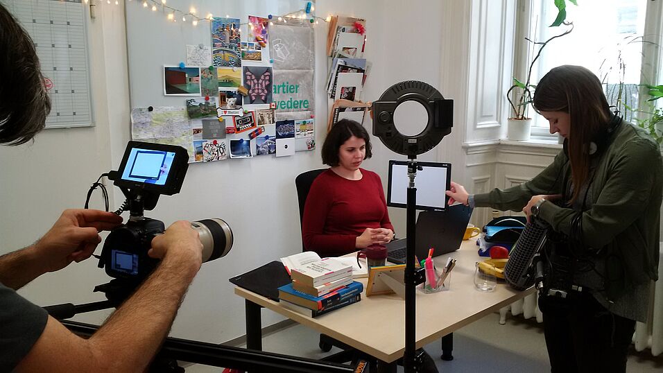 Filming the desk scene of the AUSSDA video